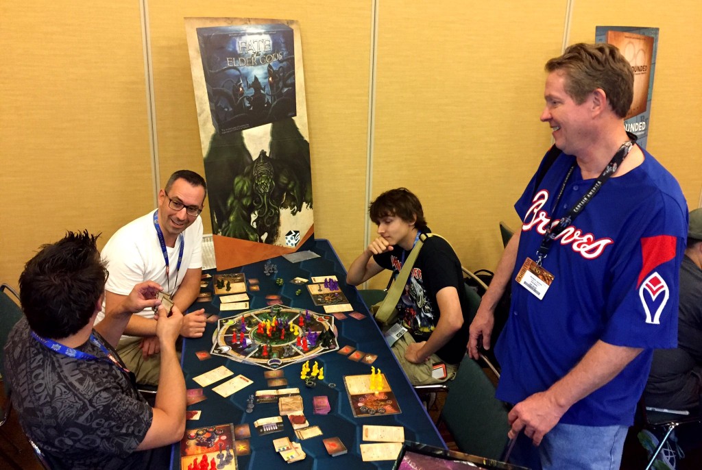 Richard Launius pops in to help with the taunting in a game of Fate of the Elder Gods. One of the players had three curses on him - not surprising since Bokrug was in the game!