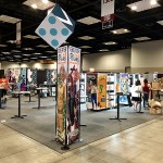 The Greater Than Games booth during set-up on Wednesday.